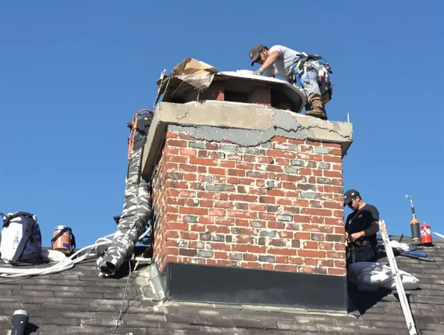 Paramount Chimney Sweep installing a custom chimney crown in Paramount, CA
