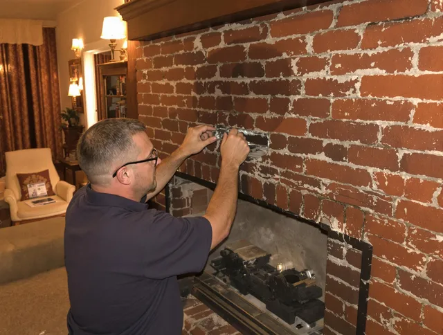 Paramount Chimney Sweep expert fixing a fireplace in Paramount, CA